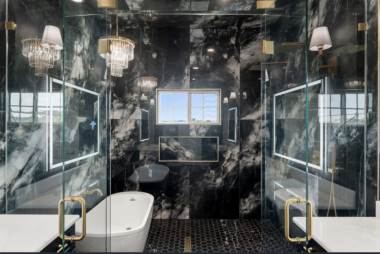 Black marble bath with glass wet room