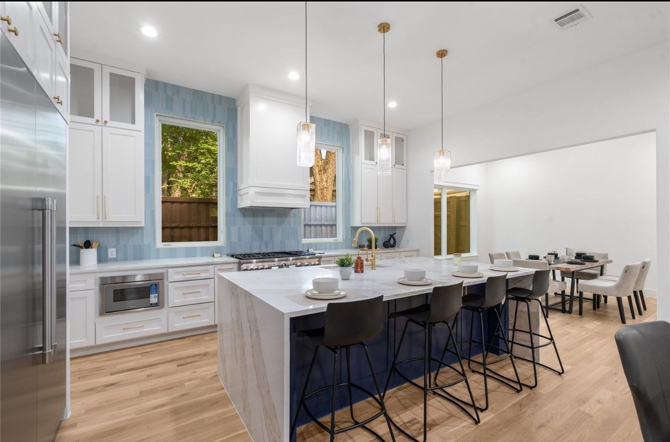 Kitchen with navy waterfall island